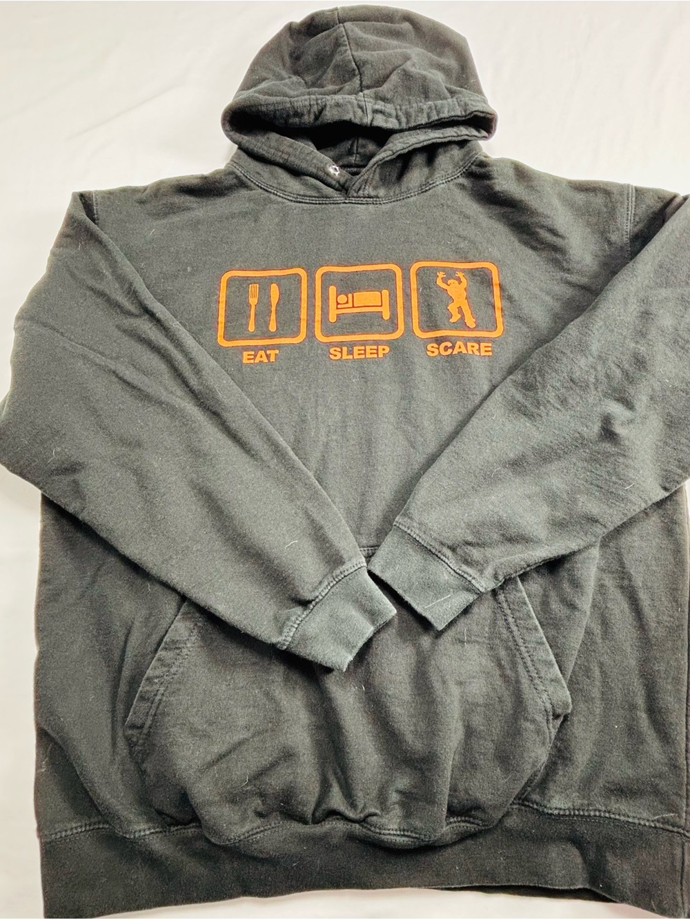 Black Hoodie Sweatshirt with Orange "Eat Sleep Scare" Graphic M545